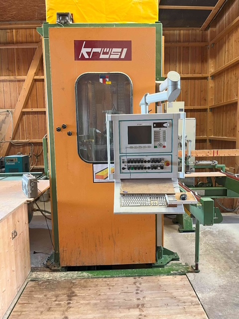 KRÜSIMATIC by Krüsi G1 – 4-axis system Krusi joinery machine 2005, Feeding/processing from right to left 6-sided processing without having to turn the wood. Total length 18 m